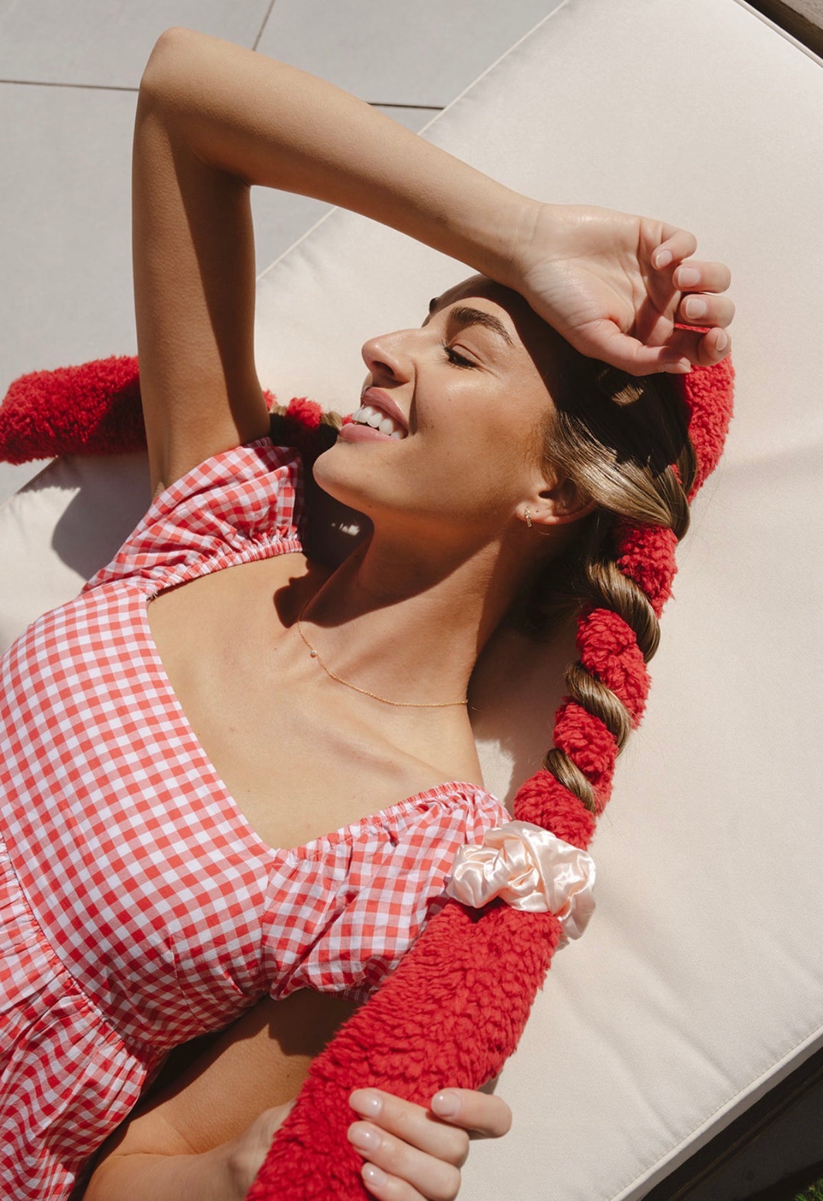 Woman with heatless curls wrapped in a red CurlBand™ using the basic wrap method
