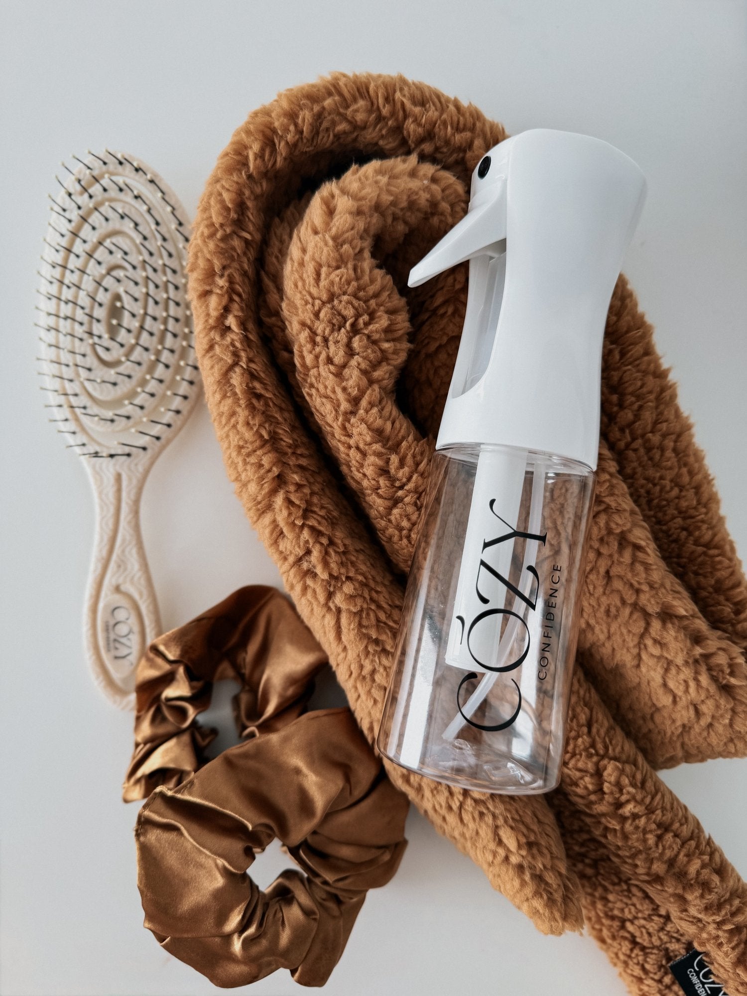 Brown Sugar Curl Kit for heatless curls with a caramel brown fluffy CurlBand, copper brown silk scrunchies, beige Volume Brush and white Cozy Confidence spray bottle