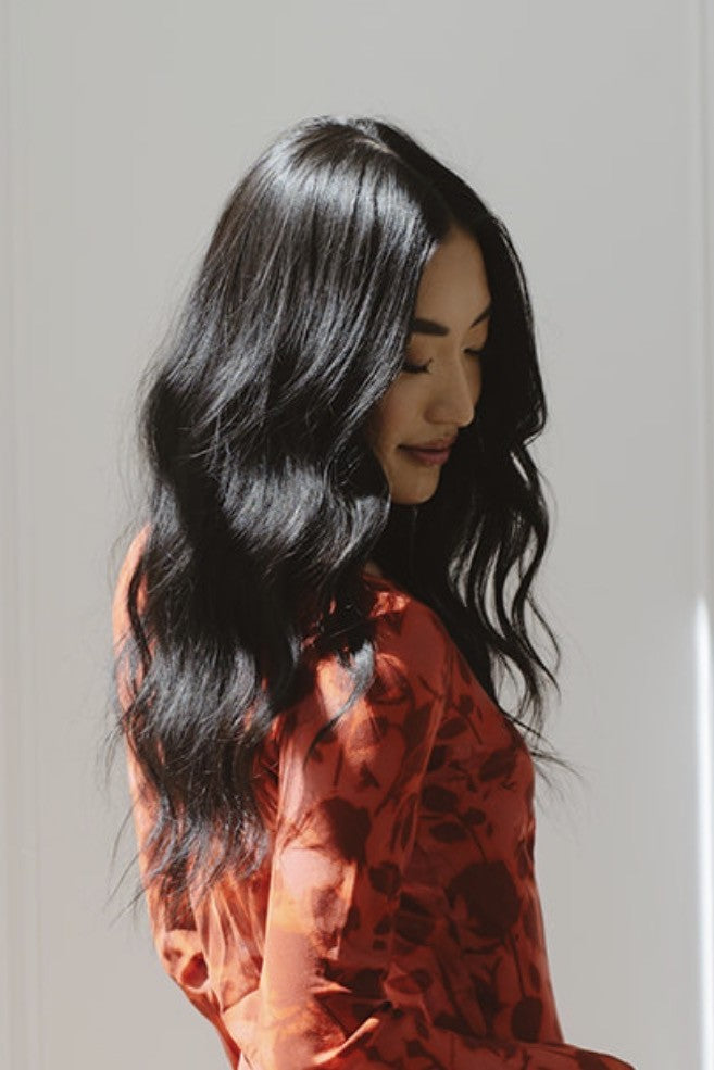 Long dark hair in soft, defined curls from the Classic CurlBand