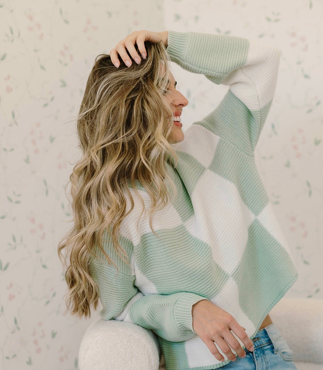 The same woman with long, soft heatless waves the next morning
