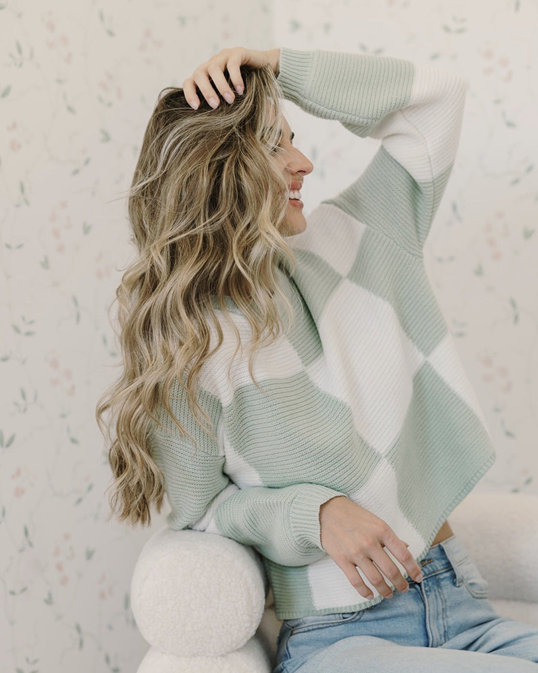 The same woman with long, soft heatless waves the next morning